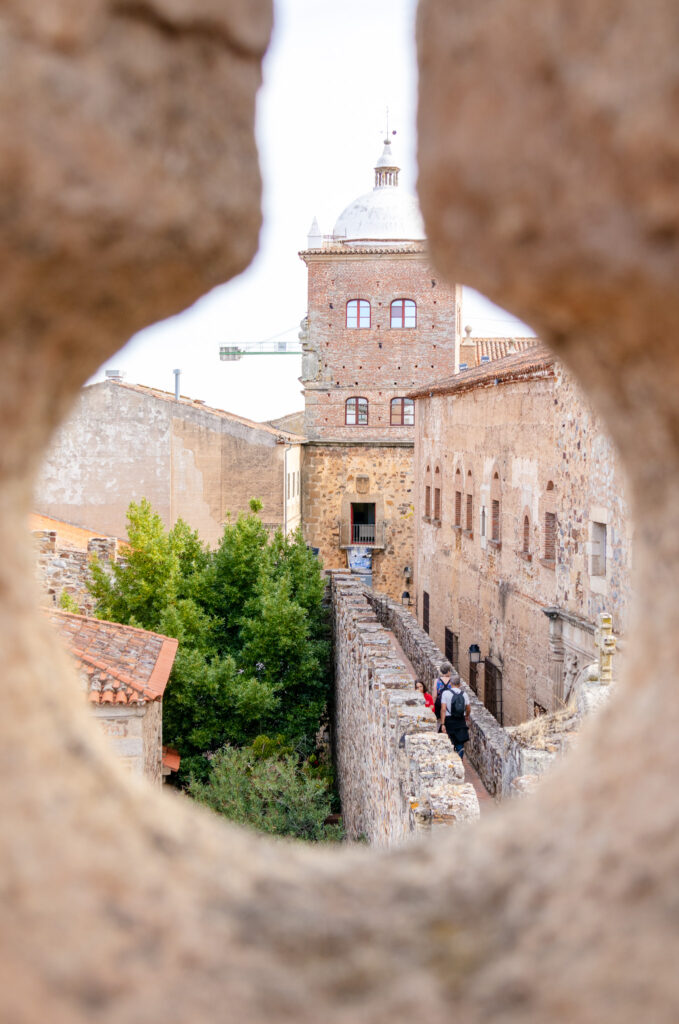 view through an arrow slot of the old city wall in caceres spain