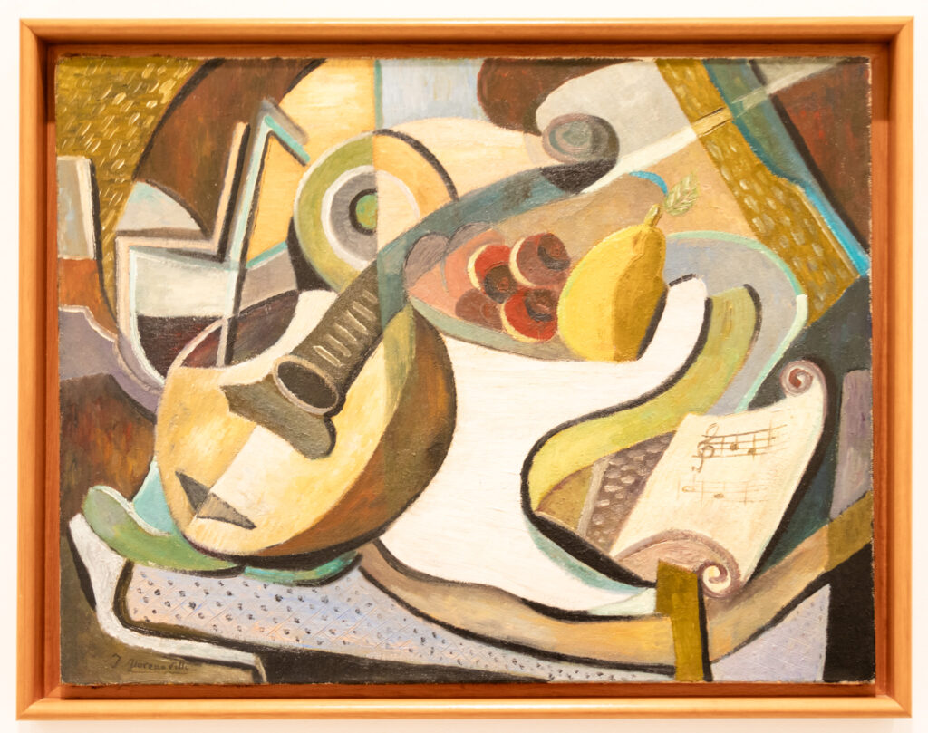 abstract painting of a guitar, fruit, and sheet music in  Reina Sofia museum madrid