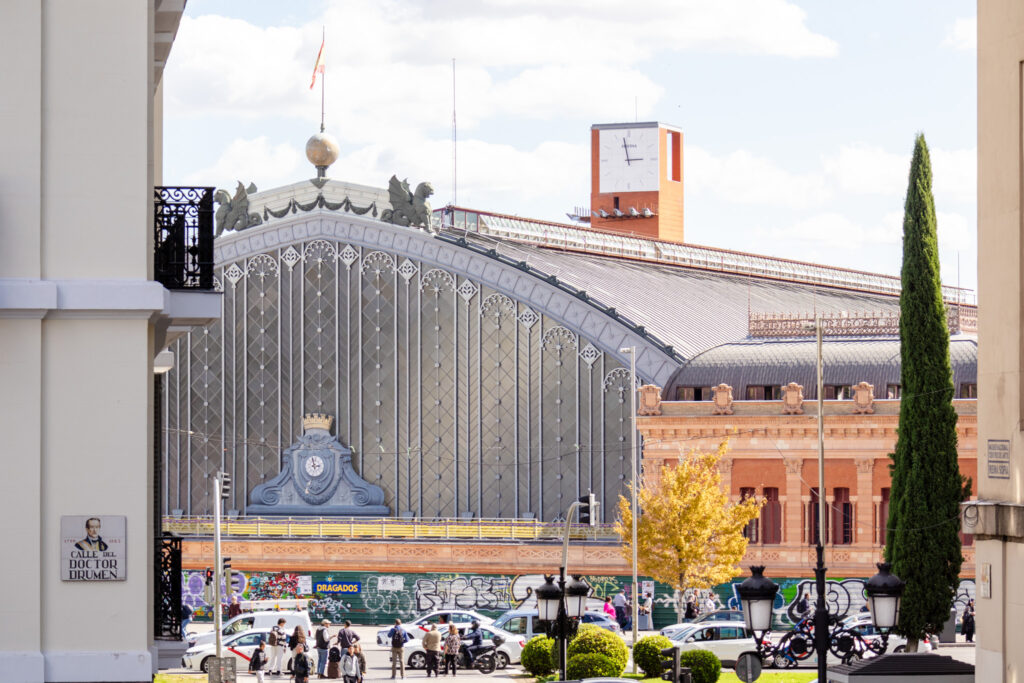 glass and steel exterior of Atocha train station in madrid