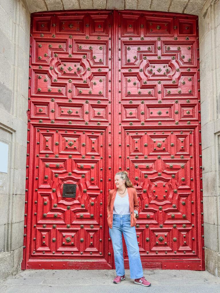 author in front of doors at scala coeli salamanca spain