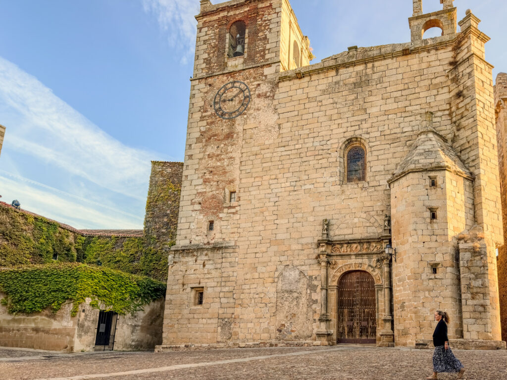 author walking in front of San Mateo church caceres spain