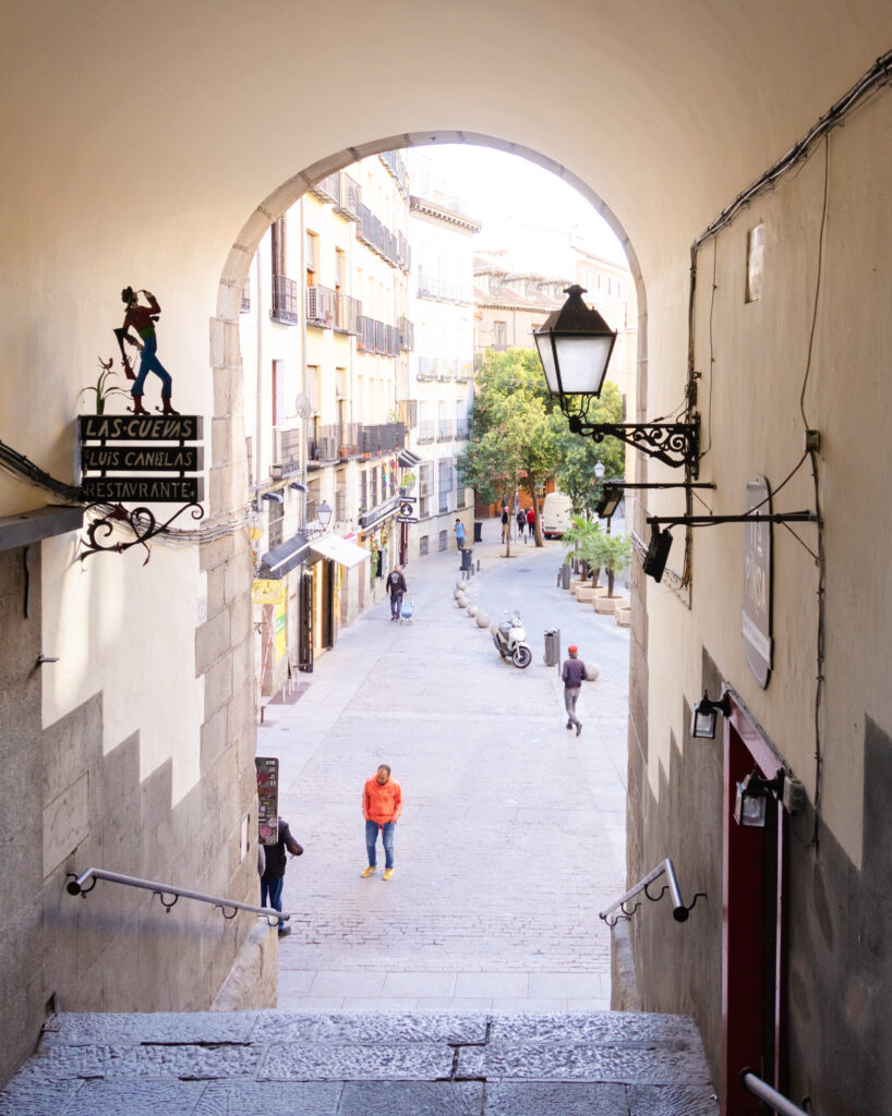 Sign for Las Cuevas restaurant in the stairs leading down from plaza mayor madrid