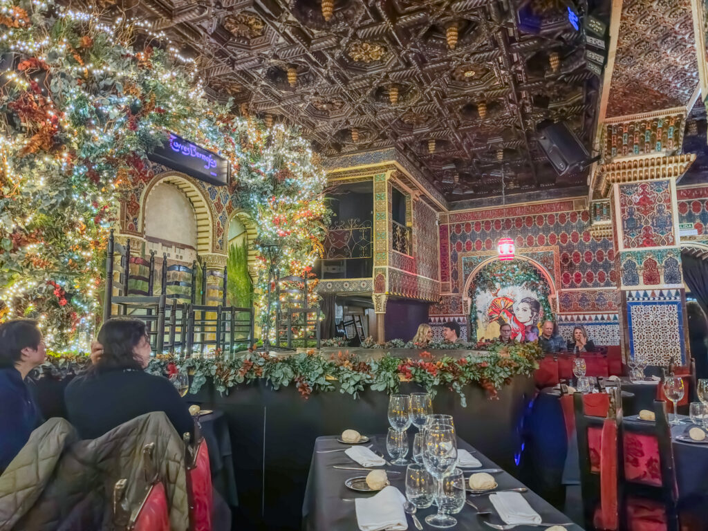 interior covered in ornate tile and lights for torres bermejas flamenco show in madrid spain