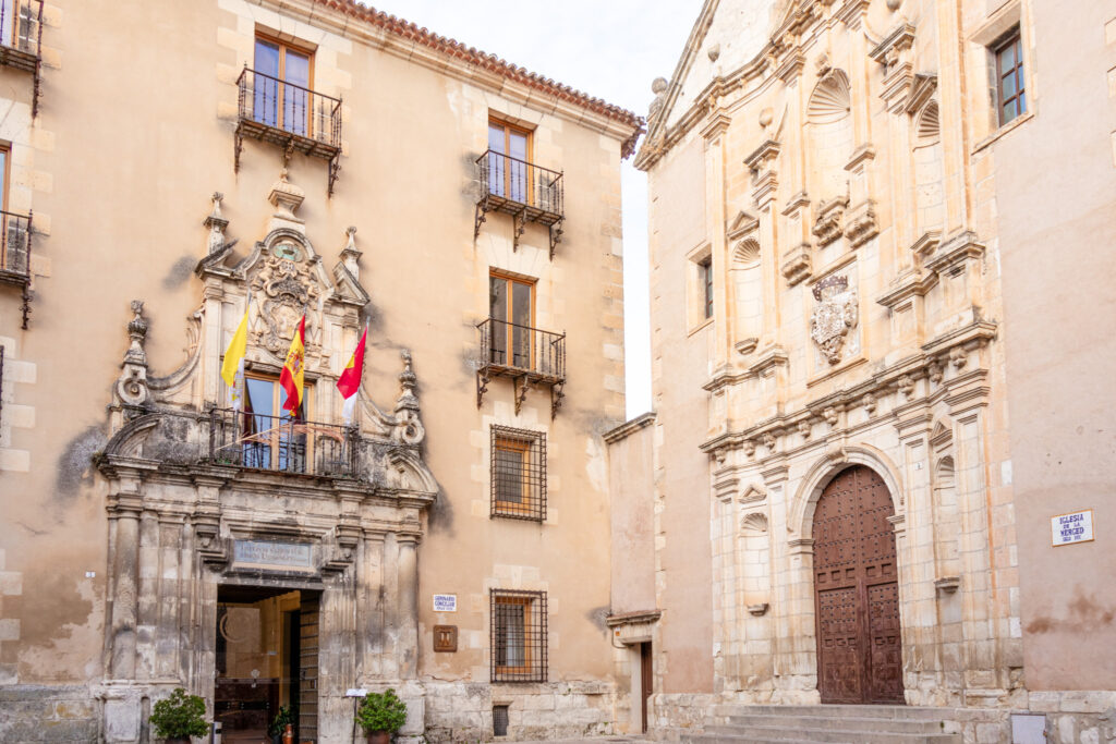 flags flying in plaza de merced cuenca spain