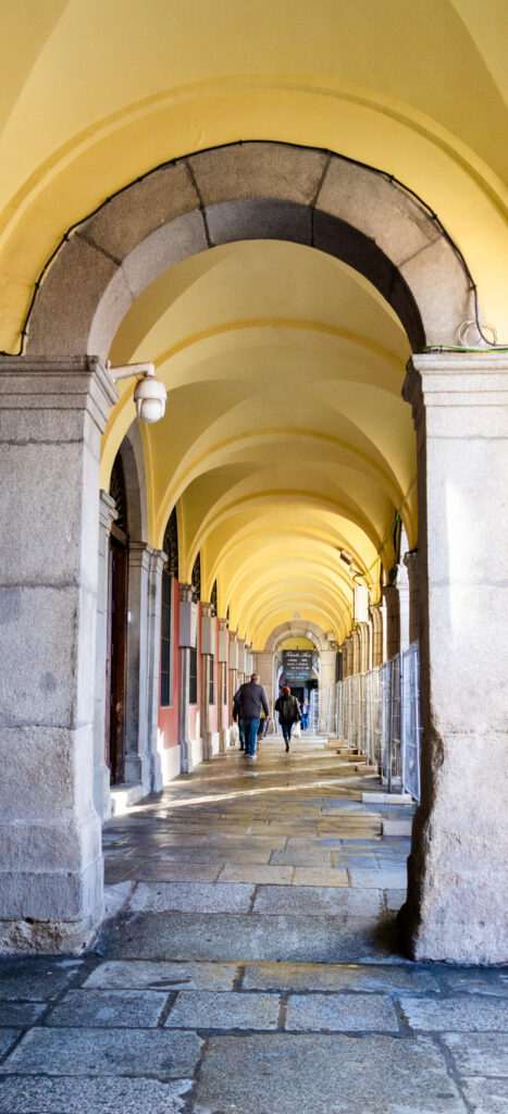 yellow colonnade of Plaza mayor madrid