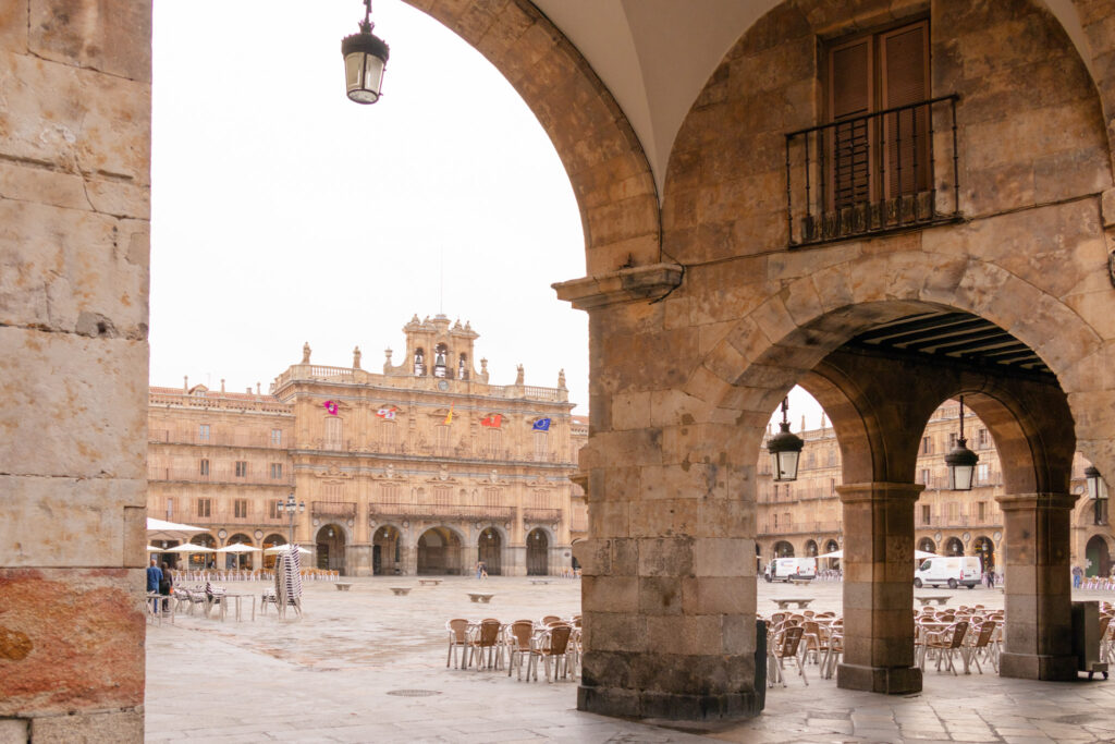 plaza mayor Salamanca seen through arcade arches