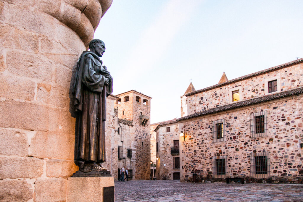 statue of San Pedro in front of caceres cathedral spain