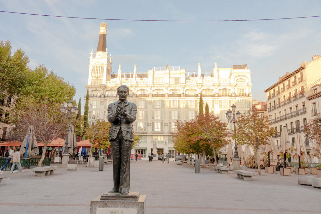 state on man holding a bird in plaza Santa Ana madrid