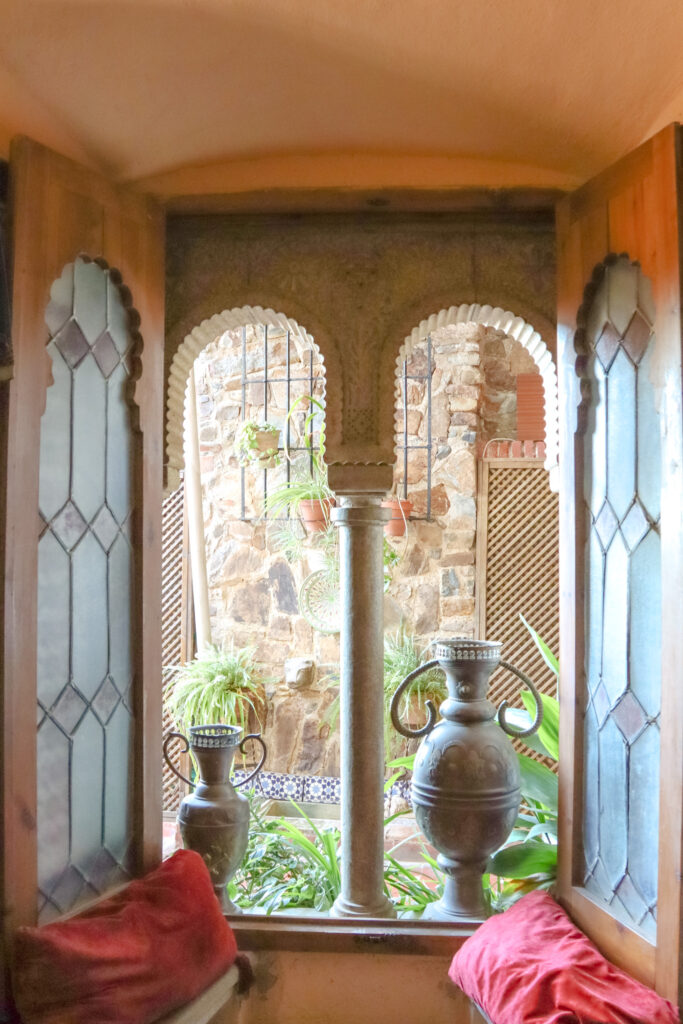 view of courtyard through windows in Arab house in caceres spain