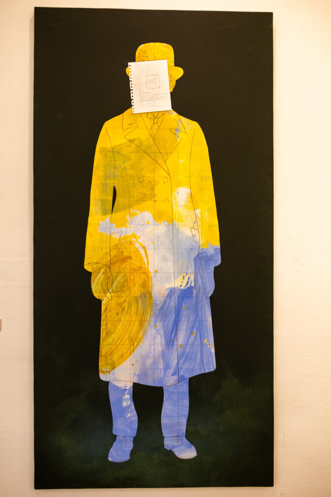 yellow and blue painting of man in museum Cuenca