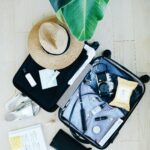 suitcase filled with travel items