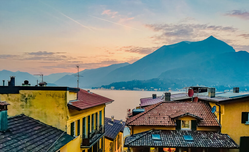 Bellagio Italy mountains at sunset over the rooftops