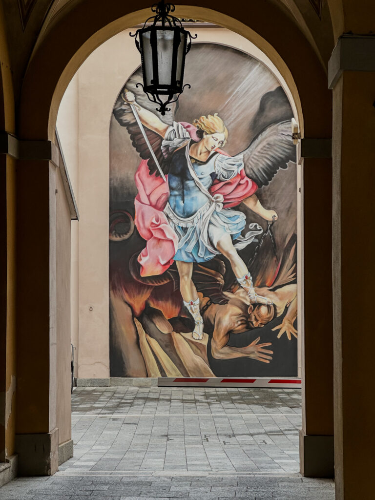 street painting in modena italy of angel slaying devil