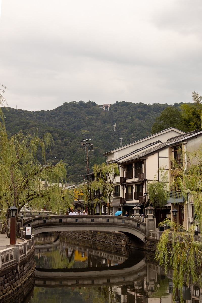 kinosaki onsen canal and kinosaki onsen ropeway in background
