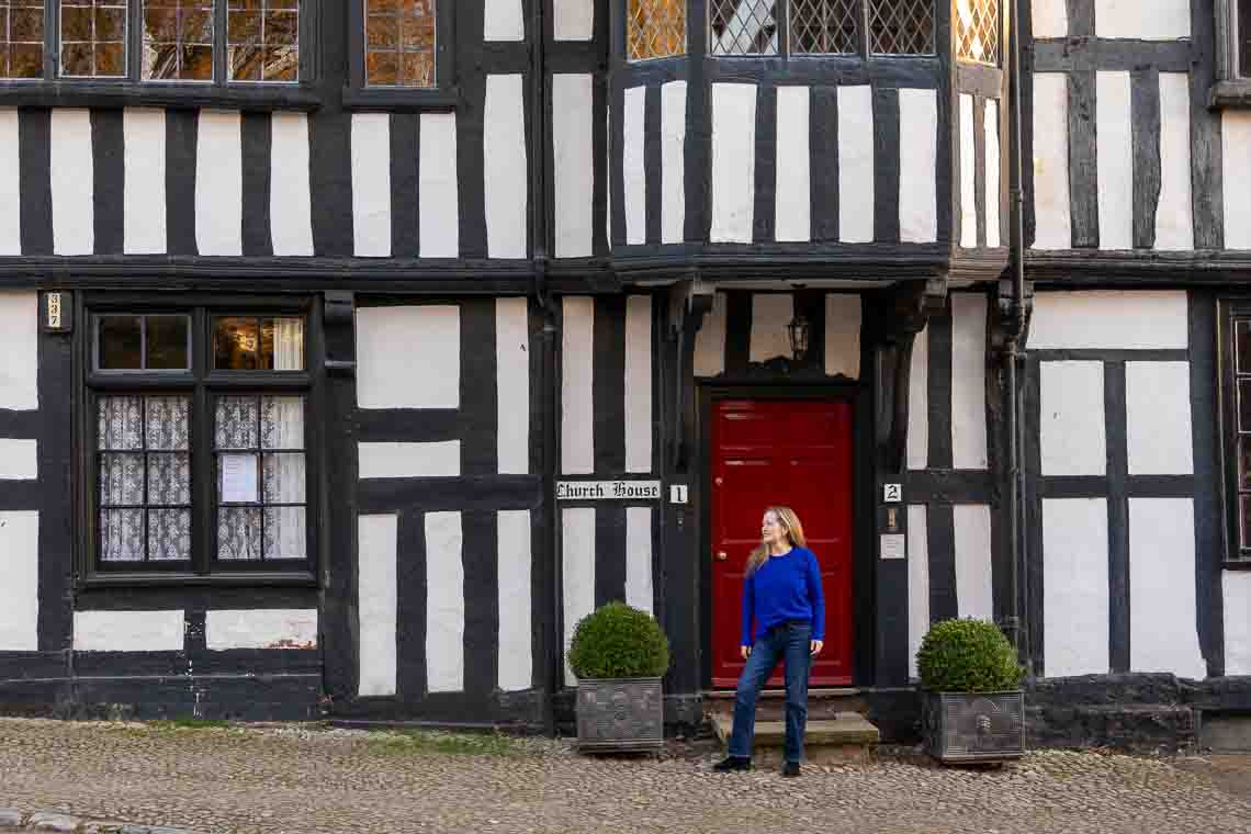 maren trying not to look like a tourist in front of the church house in ledbury england